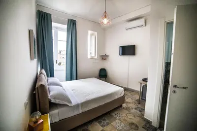 Letto o letti in una camera di Il Miracolo di San Gennaro