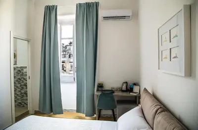 Letto o letti in una camera di Il Miracolo di San Gennaro