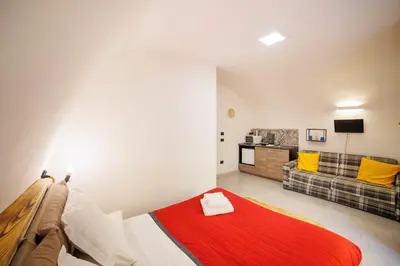 Letto o letti in una camera di Legno Suite By HouseinNaples