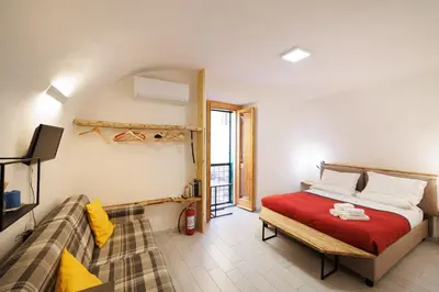 Letto o letti in una camera di Legno Suite By HouseinNaples