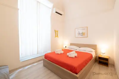 Letto o letti in una camera di Villari Guest House By DomusExtra