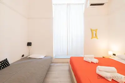 Letto o letti in una camera di Villari Guest House By DomusExtra