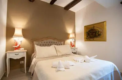 Letto o letti in una camera di Relais Bijoux Napoli