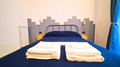 Letto o letti in una camera di Neapolitan Flat B&B
