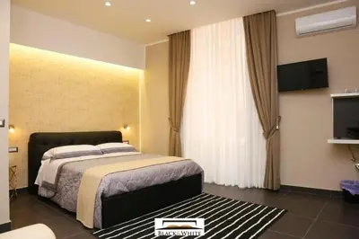 Letto o letti in una camera di Residence Black & White