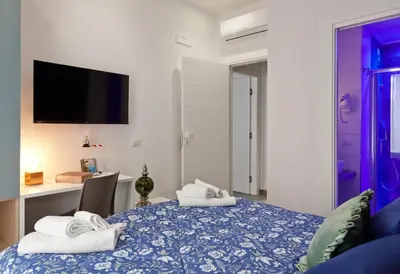 Letto o letti in una camera di Domus Schilizzi