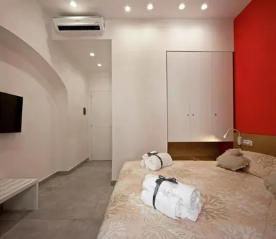 Letto o letti in una camera di Domus Schilizzi