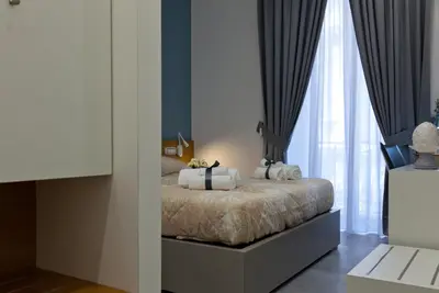 Letto o letti in una camera di Domus Schilizzi