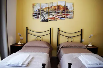 Letto o letti in una camera di Neapolis Pie