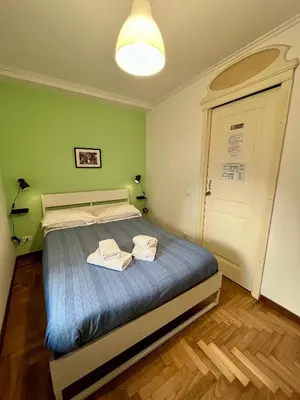 Letto o letti in una camera di Palazzo Rota GuestHouse