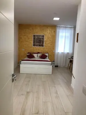 Letto o letti in una camera di FV STUDIOS Riviera