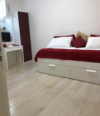 Letto o letti in una camera di FV STUDIOS Riviera