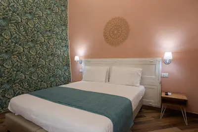Letto o letti in una camera di Tredici Boutique Rooms