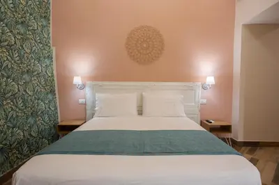 Letto o letti in una camera di Tredici Boutique Rooms