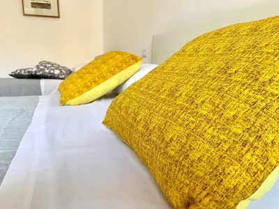 Letto o letti in una camera di casa vacanze la piazzetta