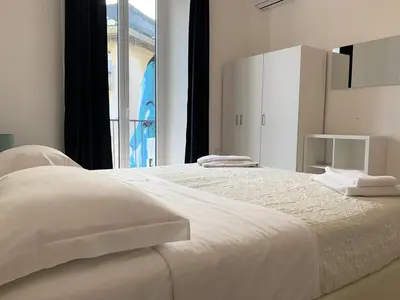 Letto o letti in una camera di casa vacanze la piazzetta