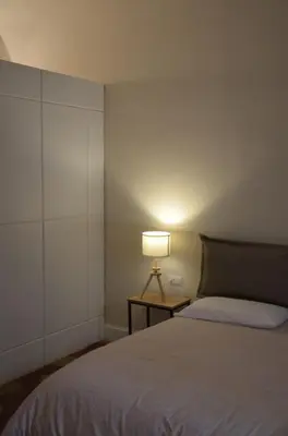Letto o letti in una camera di Palazzo Pignatelli
