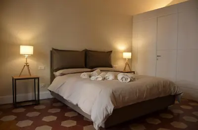 Letto o letti in una camera di Palazzo Pignatelli
