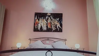 Letto o letti in una camera di Casa Fiorito