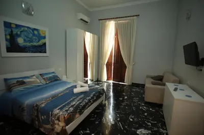 Letto o letti in una camera di Casa Fiorito