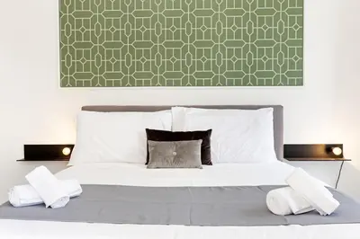 Letto o letti in una camera di Napoli Suite Caravaggio Apartment