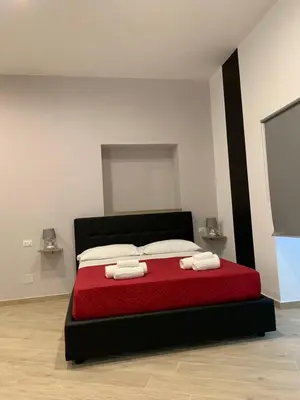 Letto o letti in una camera di Maison Arena Al Corso