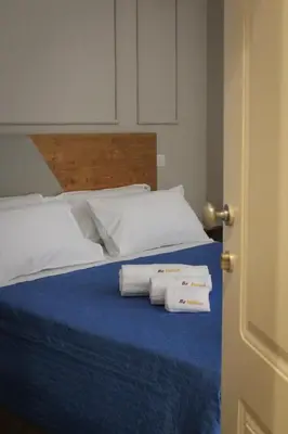 Letto o letti in una camera di Be Italian Flat Piazza Bovio 22