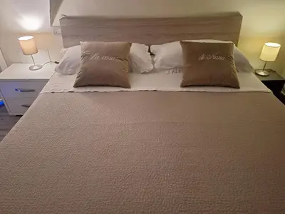 Letto o letti in una camera di LA CASA DI NANA'
