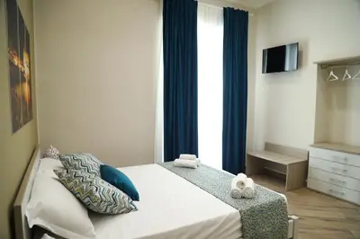 Letto o letti in una camera di Domus Cordis Napoli