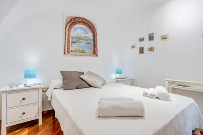Letto o letti in una camera di GuestHost - Casa Querida Central & Elegant Flat