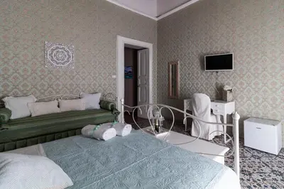 Letto o letti in una camera di Casa Maia
