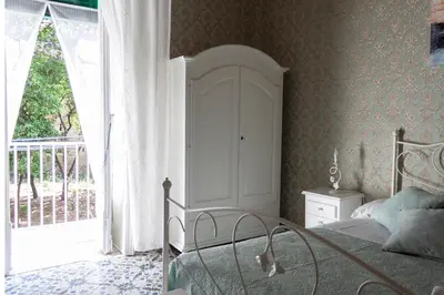 Letto o letti in una camera di Casa Maia