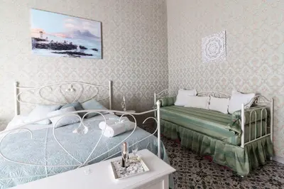 Letto o letti in una camera di Casa Maia