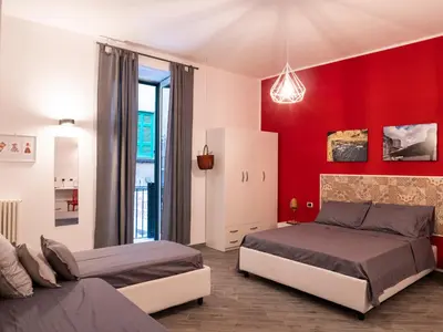 Letto o letti in una camera di B&B Cosmoneapolitan