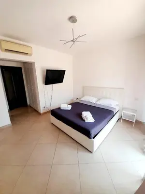 Letto o letti in una camera di Venere Penthouse Babylon