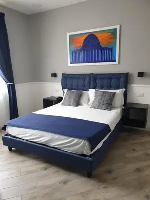 Letto o letti in una camera di Dimorra Boutique Rooms