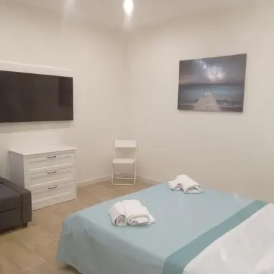 Letto o letti in una camera di DUOMO APARTAMENT'S
