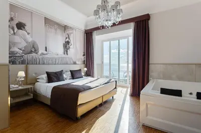 Letto o letti in una camera di Partenope Relais