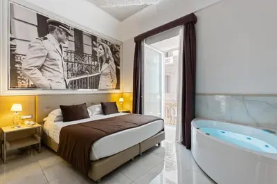 Letto o letti in una camera di Partenope Relais
