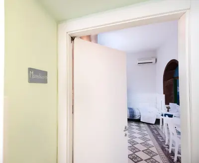 Letto o letti in una camera di Napoli Experience