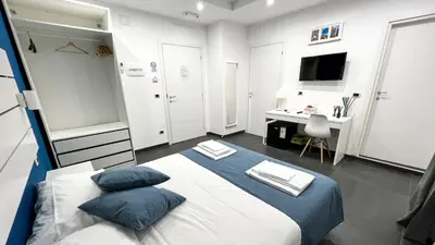 Letto o letti in una camera di Soave Rooms