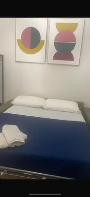 Letto o letti in una camera di DEA PARTHENOPE
