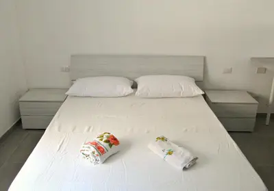 Letto o letti in una camera di Maison Ninì - Vicino Metro e Lungomare - Relax a Napoli