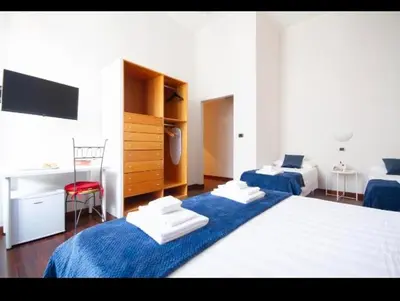 Letto o letti in una camera di B&B Residenza MALATERRA