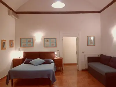 Letto o letti in una camera di B&B Amedeo