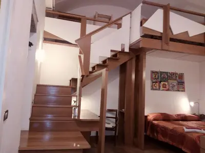 Letto o letti in una camera di B&B Amedeo