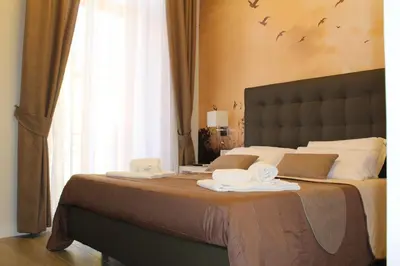 Letto o letti in una camera di Dante Relais