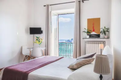 Letto o letti in una camera di NapoliCentro Mare - Sea View Rooms & Suites