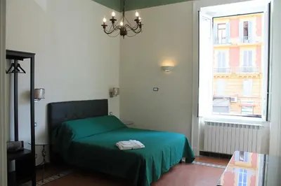 Letto o letti in una camera di Mergellina 121 Apartment's Rooms