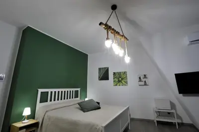 Letto o letti in una camera di Napoli Vesuvio Apartments by Dimorra